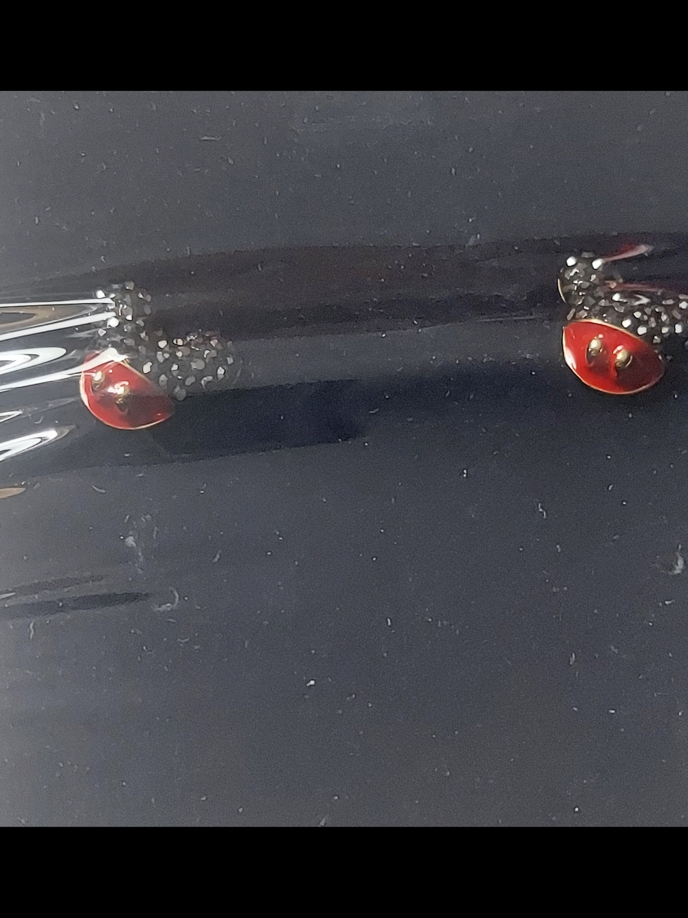 Swarovski earrings feature black crystal Mickey Mouse icons